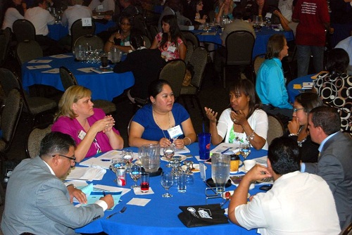 A group of staff sharing ideas in a meeting