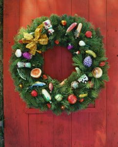 ca. 2006 --- Christmas Wreath on Red Door --- Image by © Royalty-Free/Corbis
